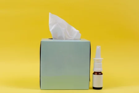 Fetch Rewards: Explained - A tissue box and nose spray, depicting how you can use your GoodRX coupon code with Fetch Rewards.