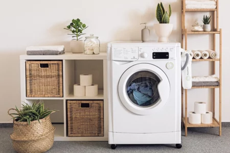 This is an image of a washing machine in action, washing clothes in cold water - a smart and cost-effective way to save money on your electric bill.